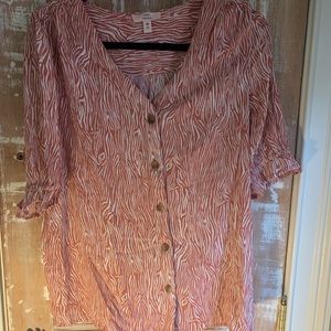 Burnt orange zebra patterned v neck button down